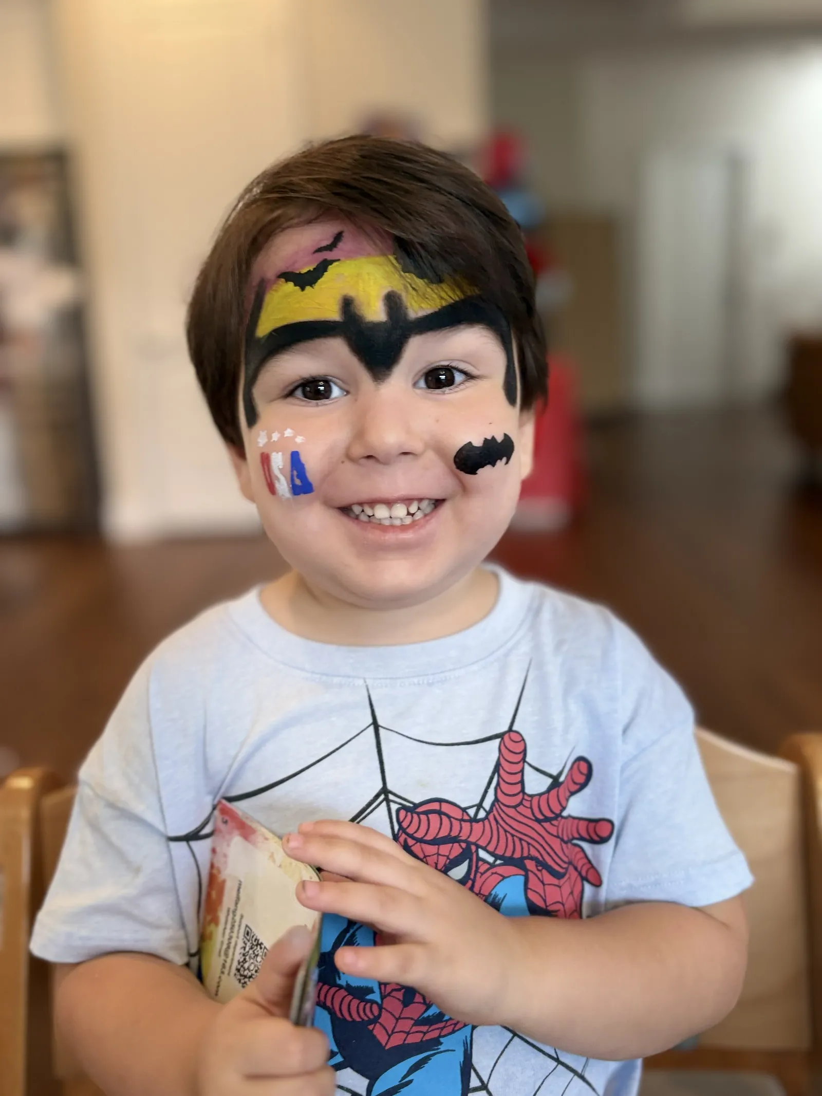 Nikko Dobbins with his face painted