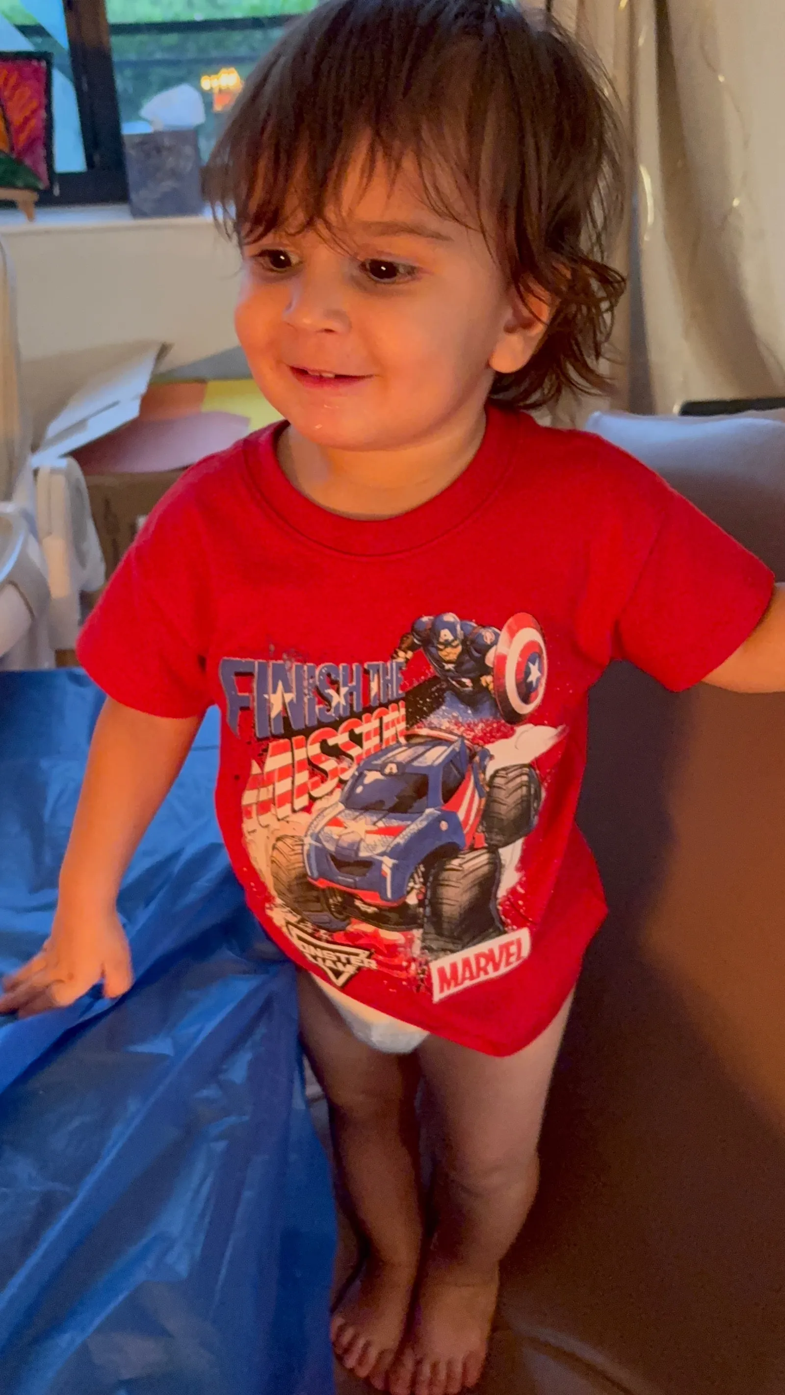 Oliver Dobbins standing and smiling